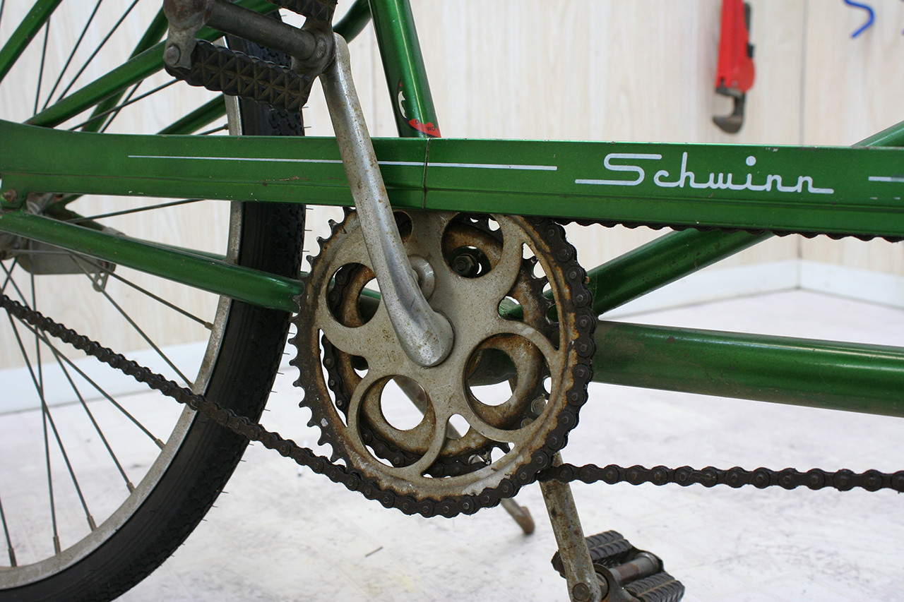 Close-up of the rear crankset of the Steve Schwinn bike before cleaning, highlighting the grease buildup.