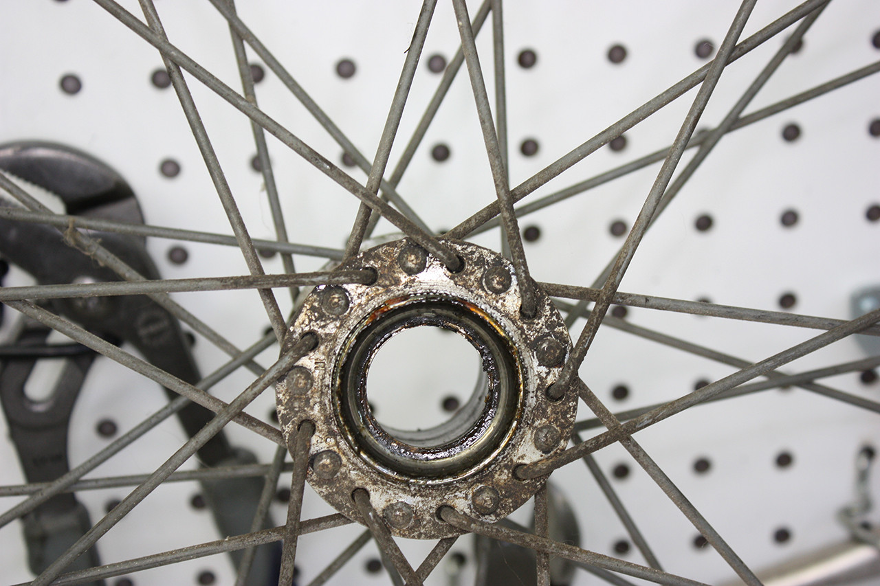 Rear wheel hub of the Steve Schwinn bike before cleaning, showing the extent of grease and grime.