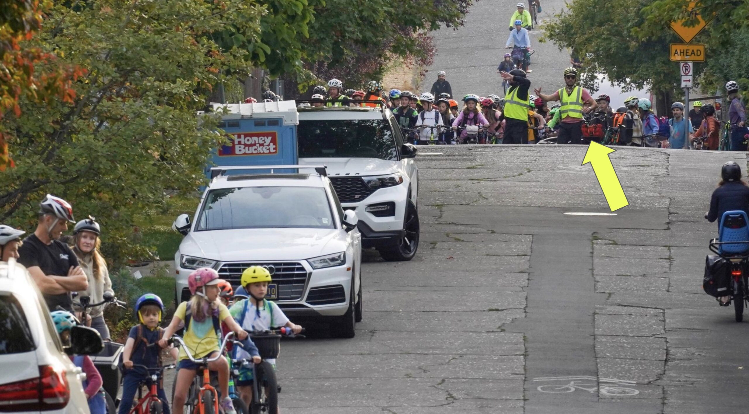 Paul assists Sam with managing the bike bus group in Portland, showcasing community support.
