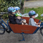 Dutch Workcycles Bakfiets family bike in blue, showcasing its classic design and spacious cargo box.