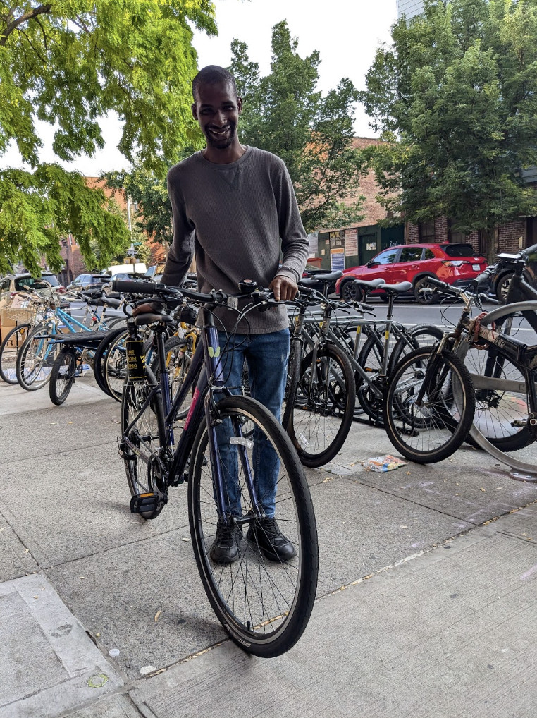 Abdoulaye Diallo, a beneficiary of Bike Plant's repair fund, highlighting the community impact of the bike shop in Brooklyn.