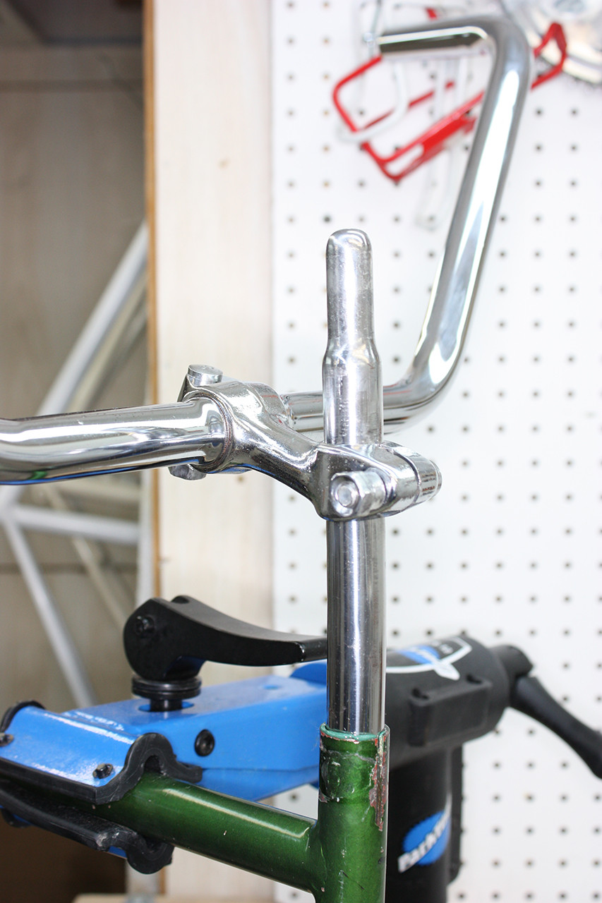Seat post and rear handlebars installed on the Schwinn Twinn Tandem after polishing, completing the passenger cockpit.