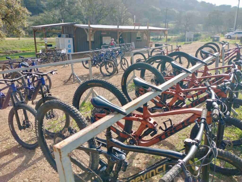 A row of rental mountain bikes available at Spider Mountain Bike Park for visitors