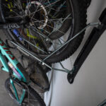 Steadyrack bike racks installed in a garage, showcasing space-saving rotation feature.