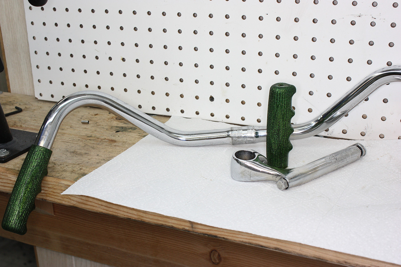 Stem and handlebars of the Schwinn Twinn Tandem cleaned and polished, demonstrating significant cosmetic improvement.
