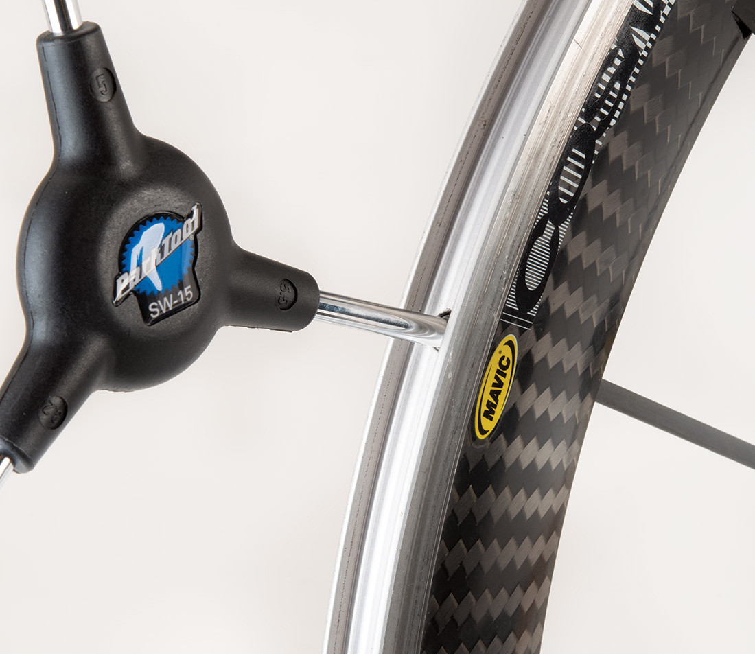 SW-15 Spoke Wrench with end on internal spoke nipple of carbon fiber road bike rim
