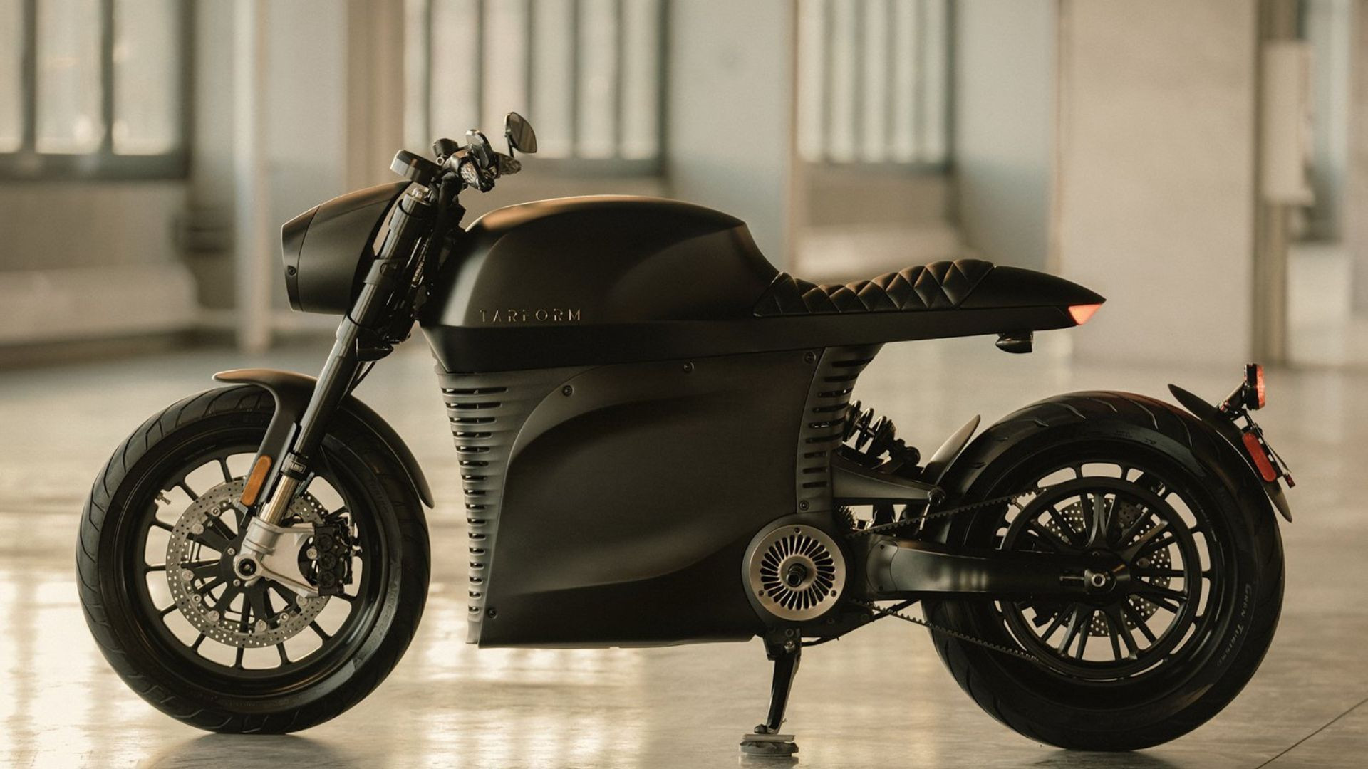 Side view of a Tarform Luna electric cafe racer motorbike