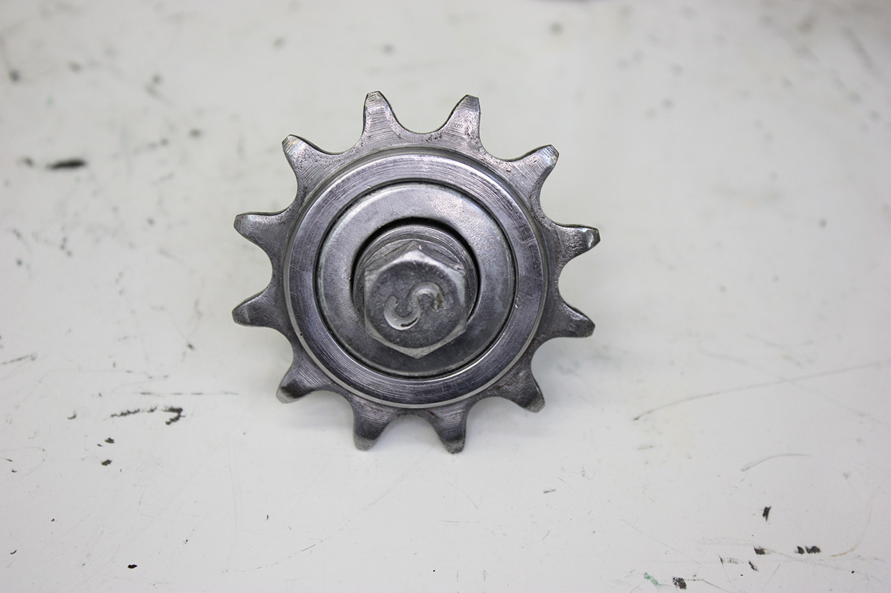 Tension wheel of the vintage Schwinn tandem polished, demonstrating the final stage of component restoration.