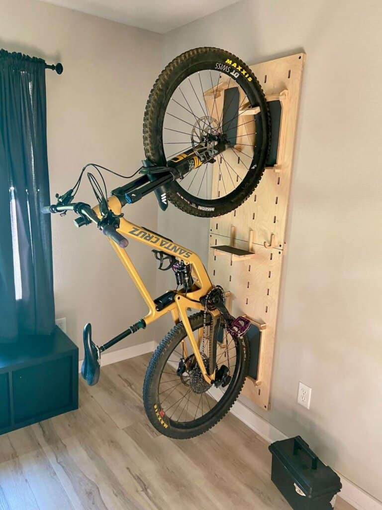 Mountain bike hanging on wooden vertical bike rack at the Bike Inn in Bentonville