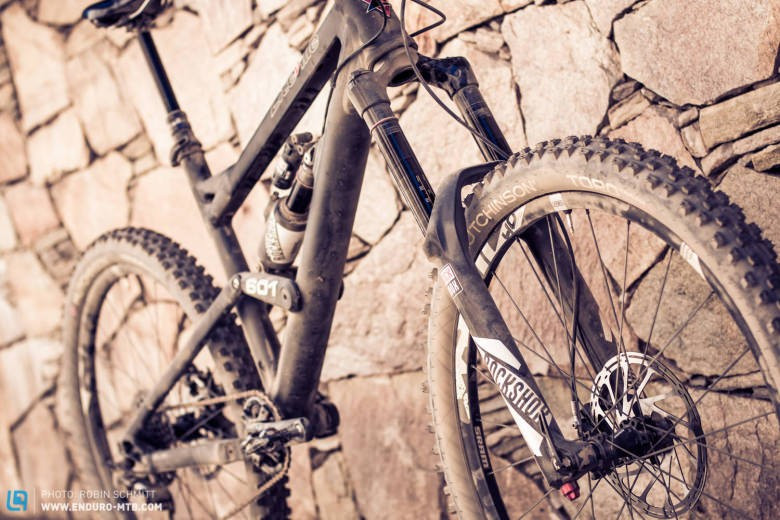 Close up of mountain bike tires on a rocky trail