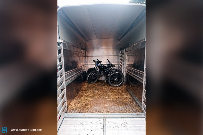 A horse trailer being used as a shuttle for mountain bikers