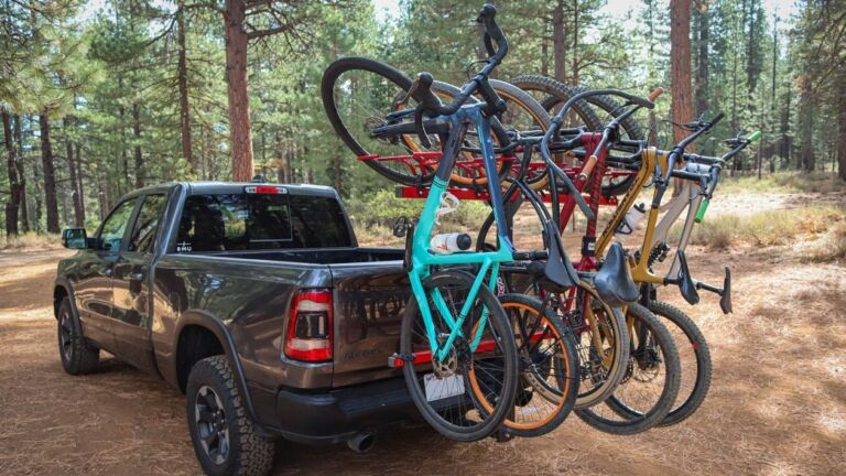 The Velocirax 5X bike rack mounted on a vehicle, demonstrating its compact vertical design for easy bike transport.
