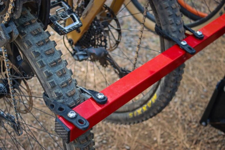 Close-up of multiple bikes loaded on the Velocirax 5X bike rack, showcasing its capacity and versatility for different bike types.