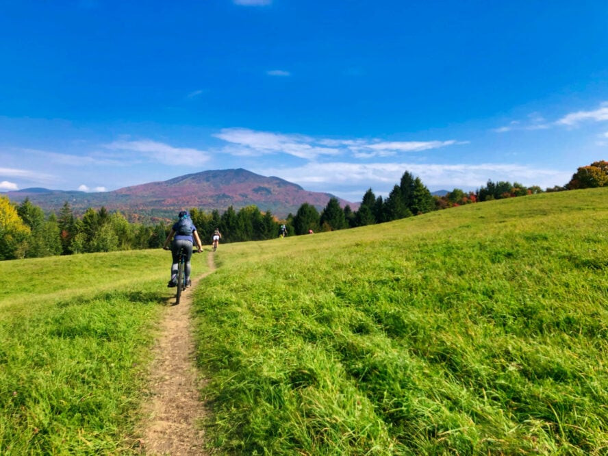 A scenic overview of Kingdom Trails, emphasizing the well-maintained paths and beautiful landscapes that make it ideal for mountain biking beginners.