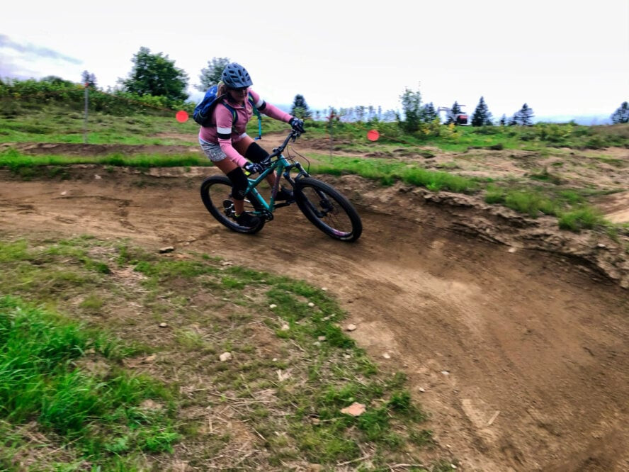 Berms and turns on Kingdom Trails, showcasing the well-designed trails that offer skill-building opportunities for mountain bikers of all levels, including beginners as they progress.