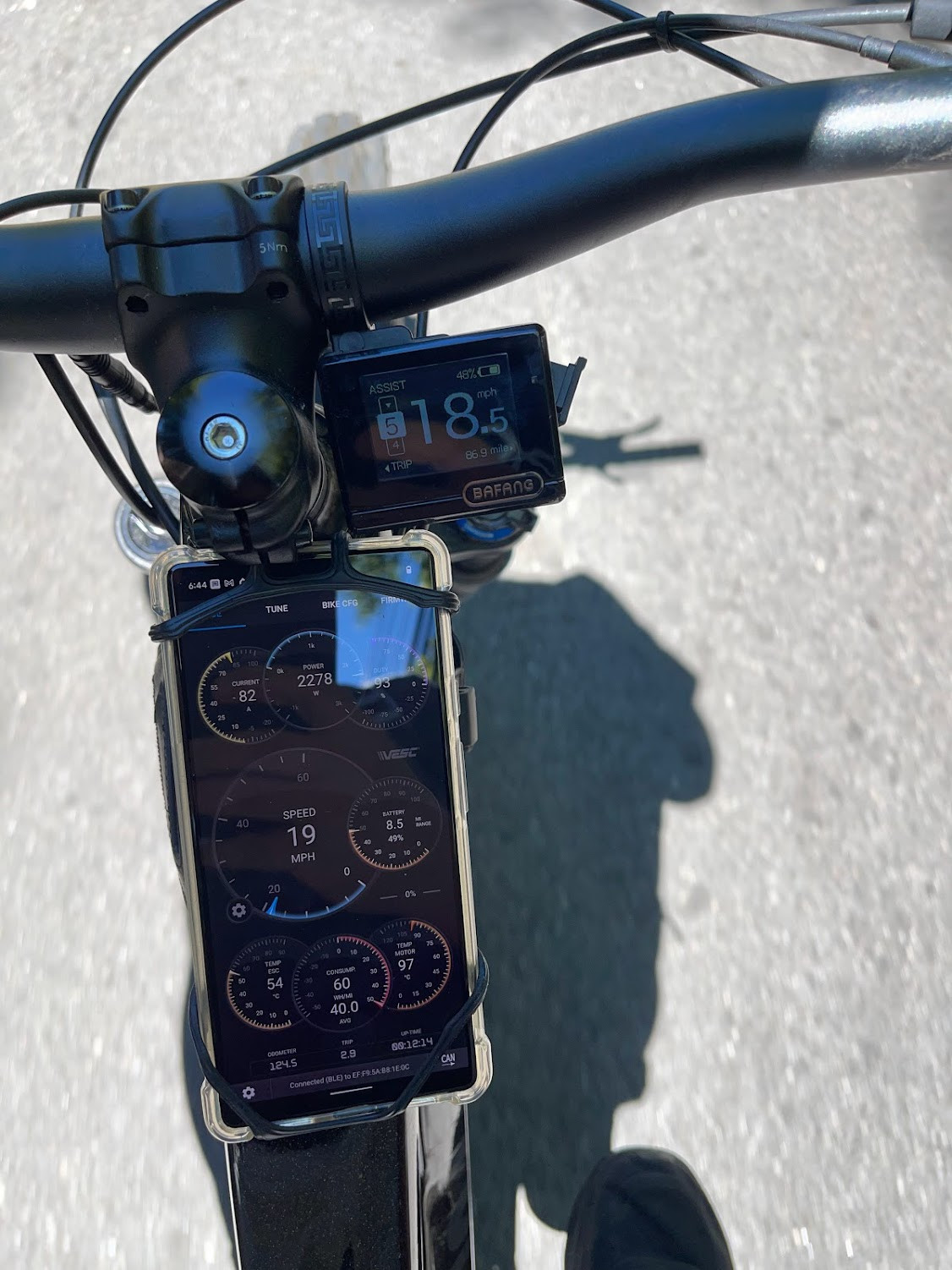 Multiple images of the VESC app interface on a smartphone displaying various bike metrics.
