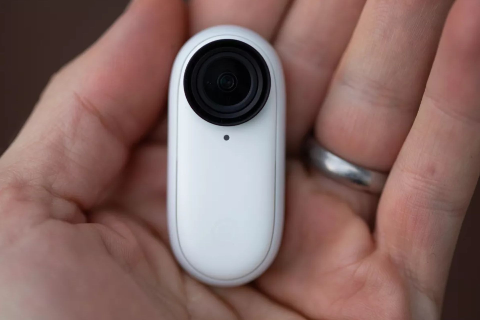 Cyclist wearing the small Insta360 Go 2 action camera mounted on their helmet