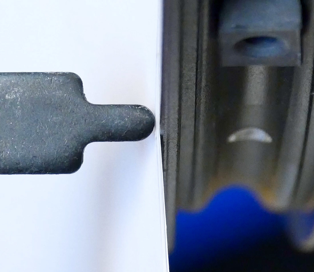 Stack of paper between truing stand indicator and wheel being trued