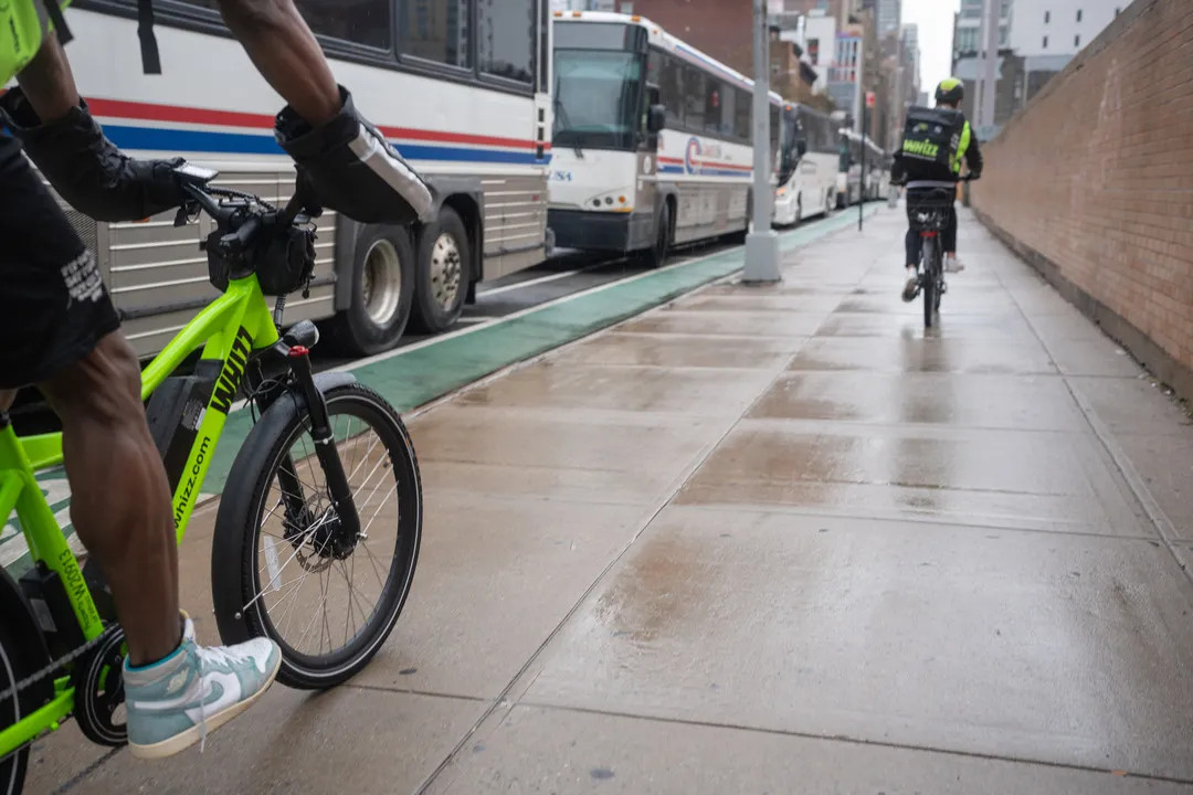 riding_e-bike_for_delivery.webp
