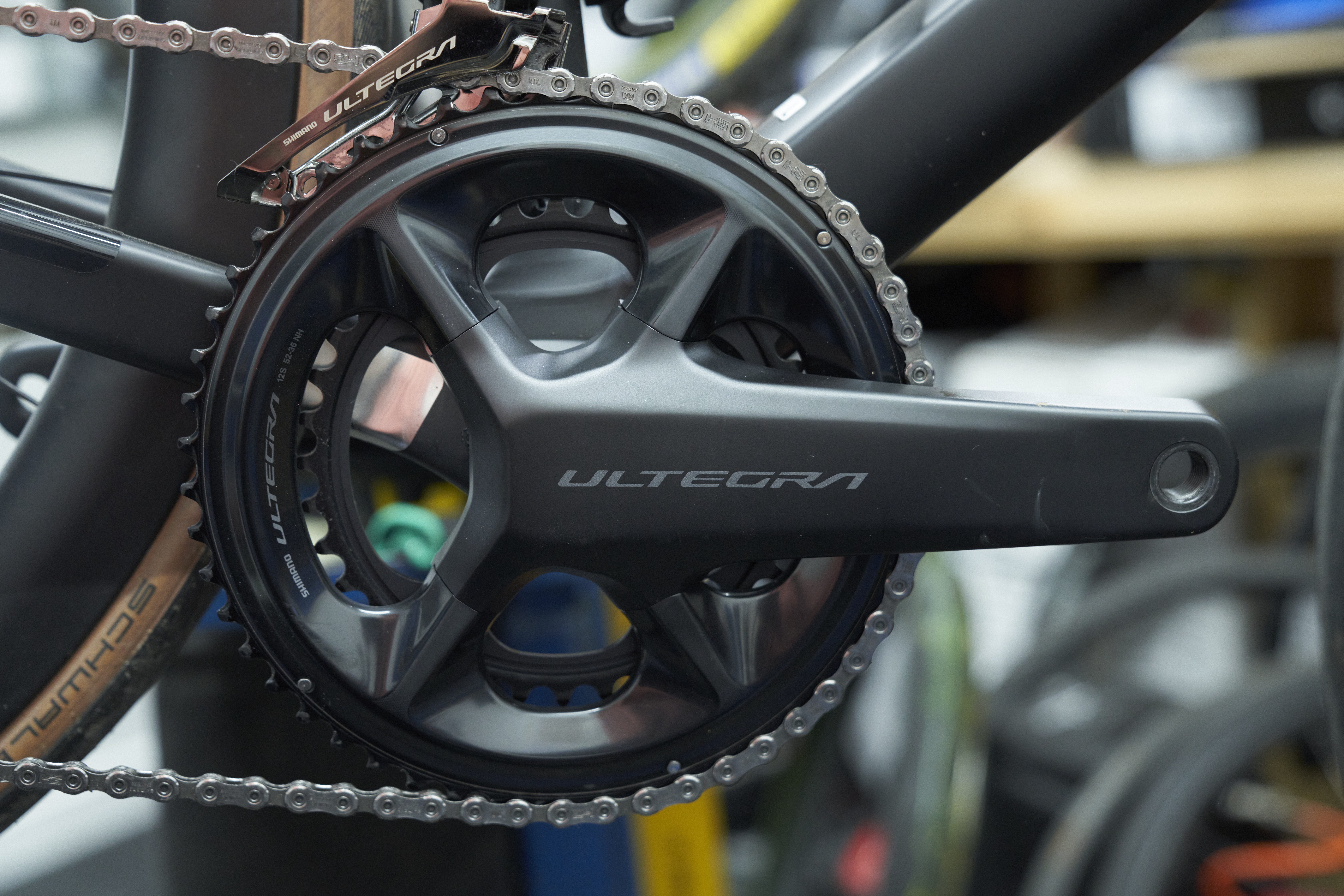 Shimano Ultegra R8100 crankset on a bike, emphasizing the 110mm BCD which allows for a full range of chainrings without needing to swap the crankset