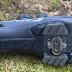 The sole of a Specialized S-Works Recon shoe showing the SPD cleat beneath