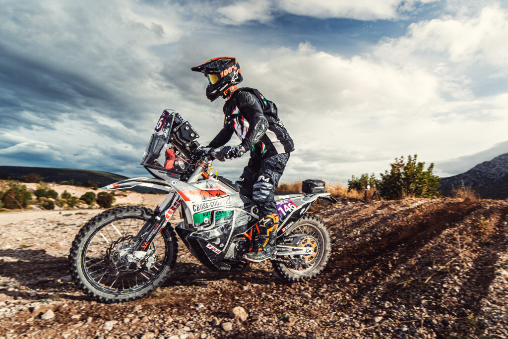 Rider demonstrating proper foot placement on dirt bike footpegs for control and stability
