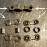 Bike chain parts A detailed view of a bicycle chain showing side plates, pins, and rollers