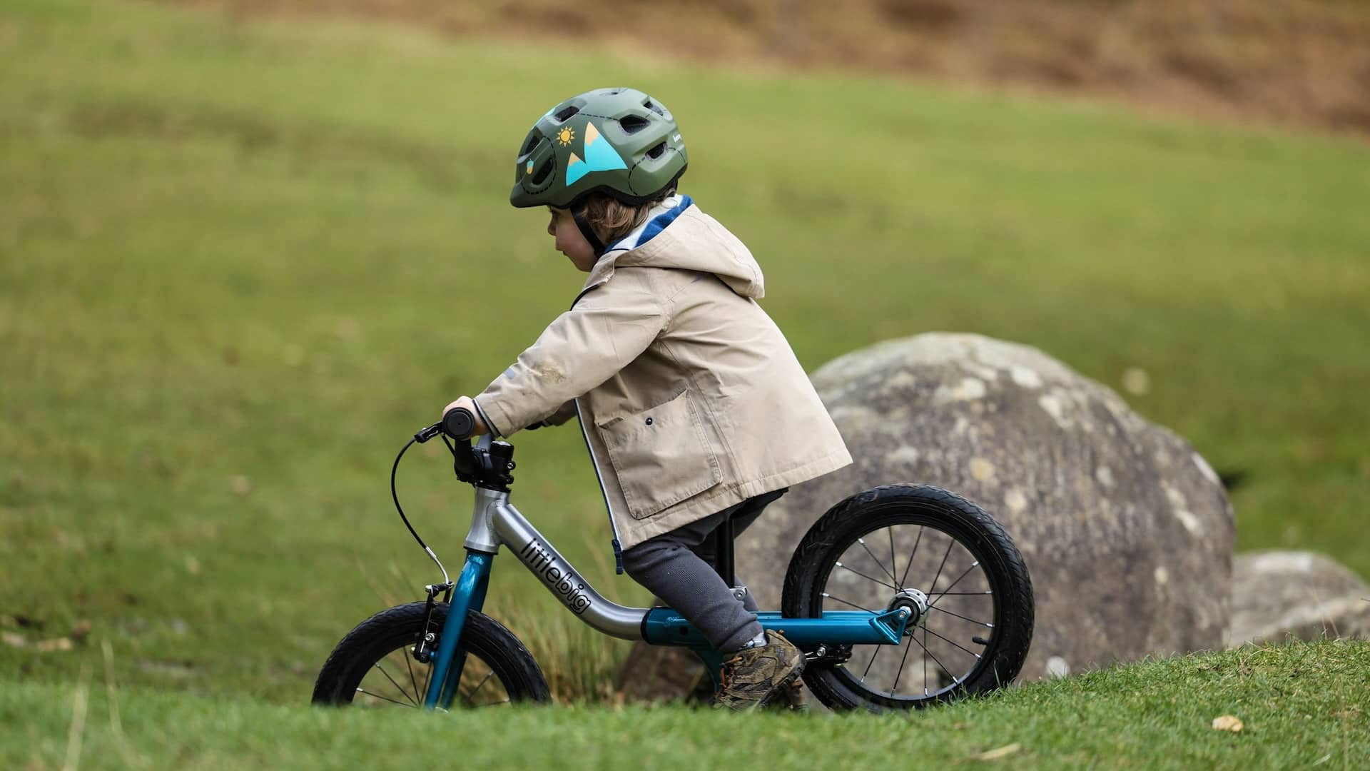 Boy age 3 going downhill on LittleBig bike