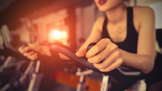 Woman enjoying a stationary bike workout