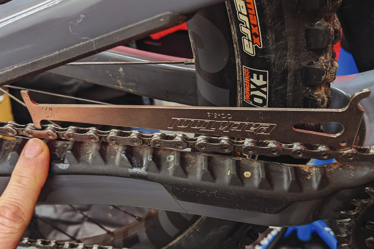 Chain checker tool. A chain checker being used to measure chain wear