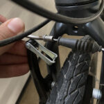 Disconnecting a V-brake to remove the wheel