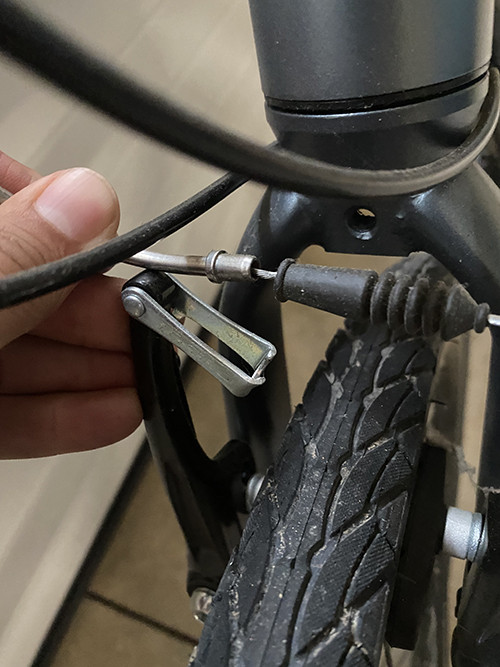 Disconnecting a V-brake to remove the wheel