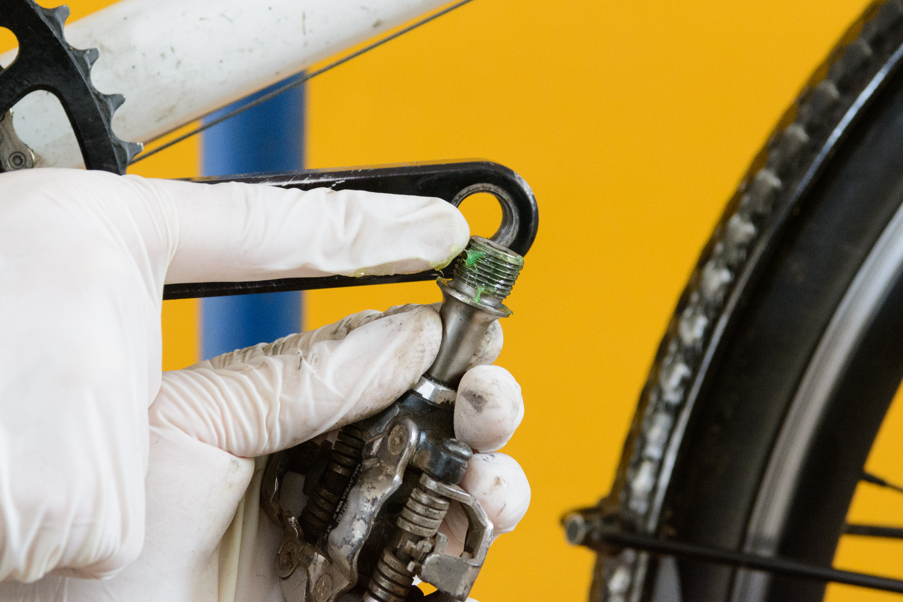 Greasing the threads of a bike pedal before installation