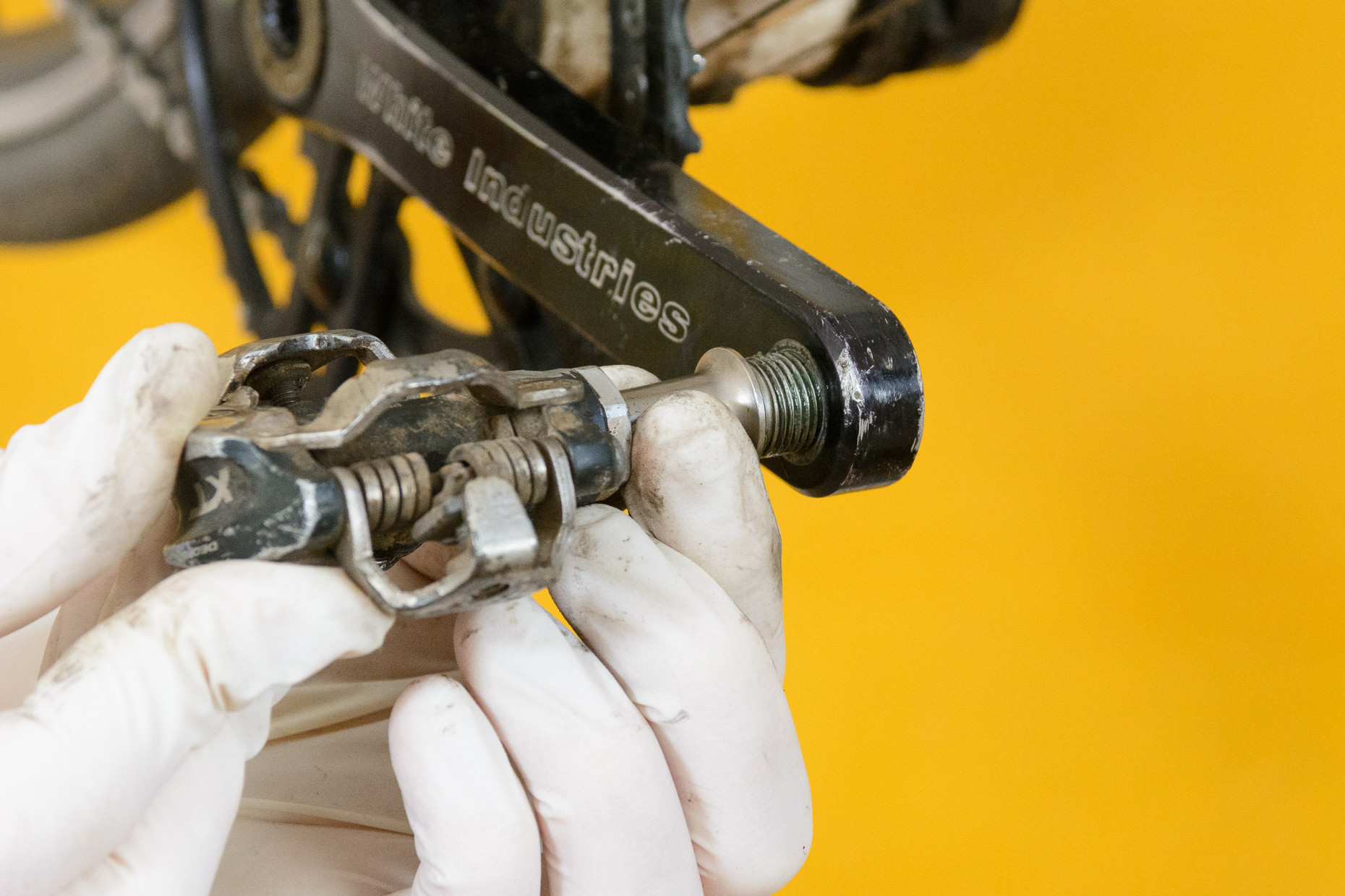 Hand-threading a bike pedal into the crank arm
