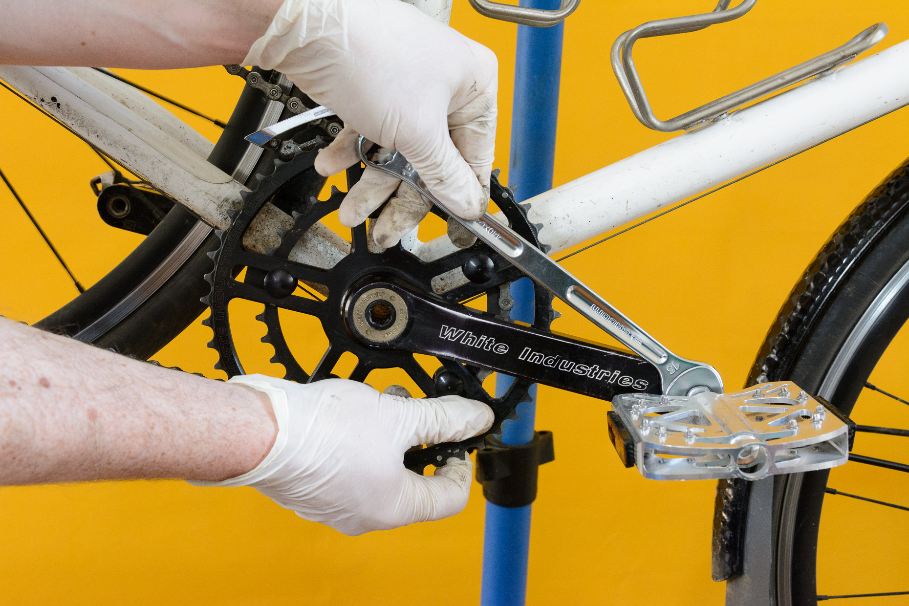 Image showing the correct positioning and tool placement for removing the left bike pedal