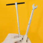 Tools required for bike pedal removal, including a 15mm spanner and 8mm hex key