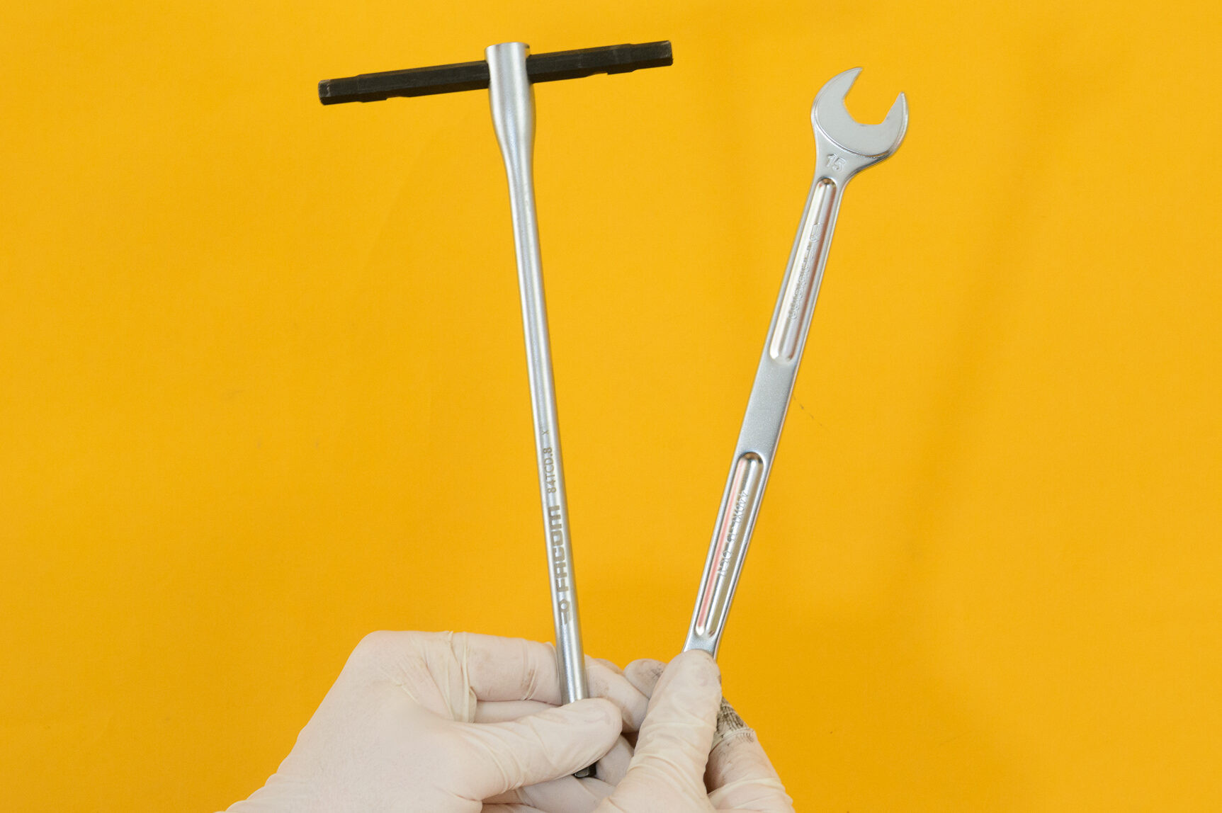 Tools required for bike pedal removal, including a 15mm spanner and 8mm hex key
