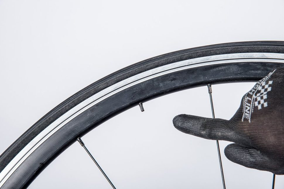 Securing a motorcycle for wheel removal