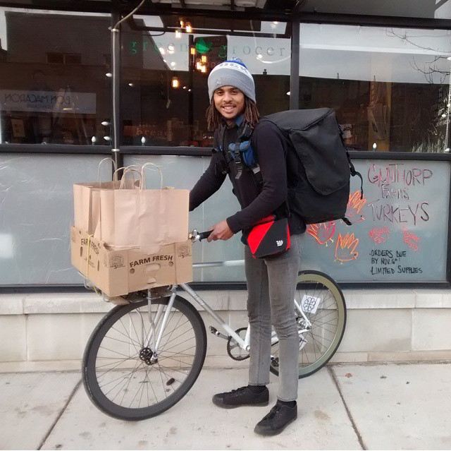 Justin in Chicago delivering for a Supermarket Co-op showcases the role of bike messengers in local commerce