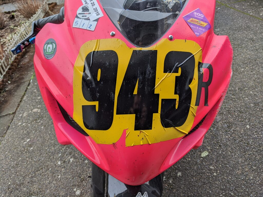 Creases and bubbles in race number application