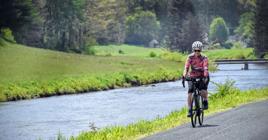 E-bike rider on a scenic trail, showcasing responsible riding
