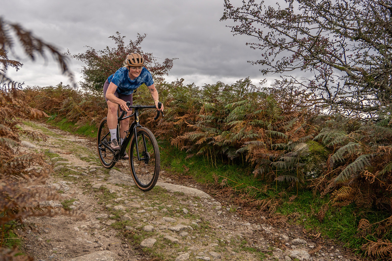 Female cyclist enjoying smooth ride on Liv Devote Advanced Pro women's gravel bike