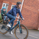 Ribble electric hybrid bike with child on seat