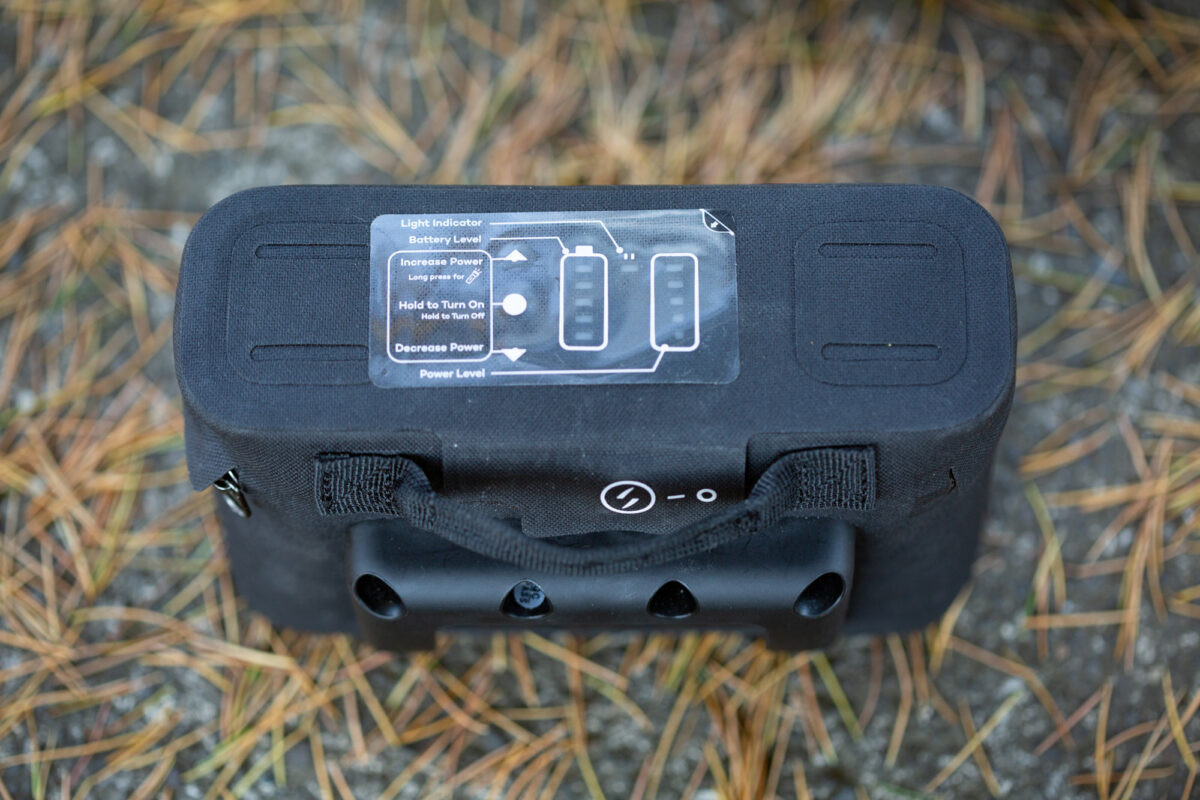 Handlebar mount bracket of a Swytch electric bike, designed for quick and secure attachment of the power pack, offering a stable and easily accessible control system.