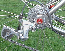 Pull back the rear derailleur by hand for easy wheel removal/installation.