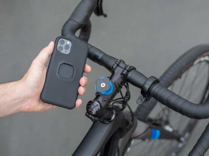 Quad Lock mounting system, showing the stem mount and a phone in the required case