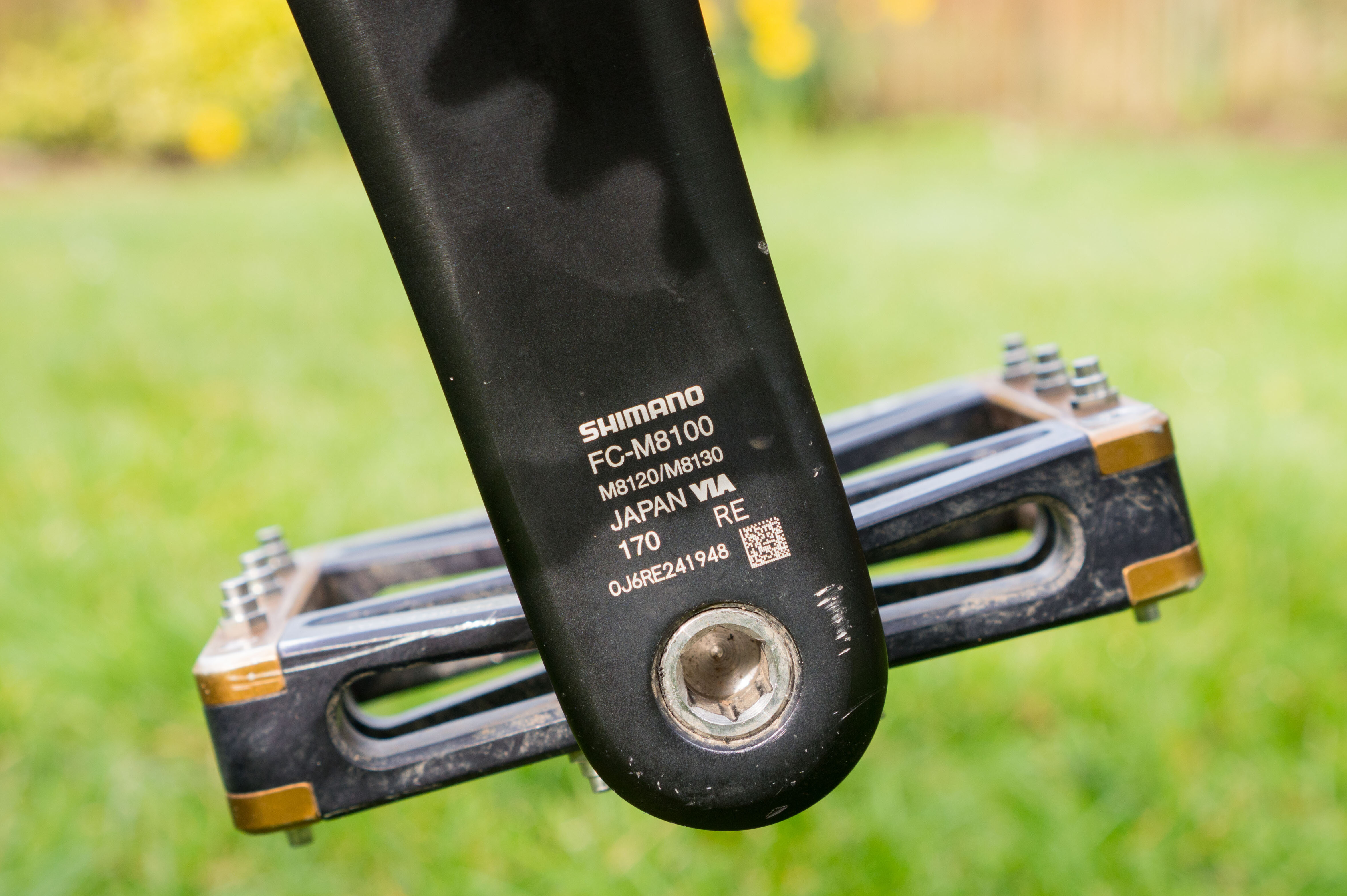 Shimano Deore XT M8100 12-speed mountain bike drivetrain, highlighting the visibility of the crank length ('170') on the crank arm