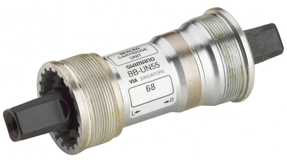 Older square taper-style bottom brackets include the axle upon which the crankset rotates - Shimano