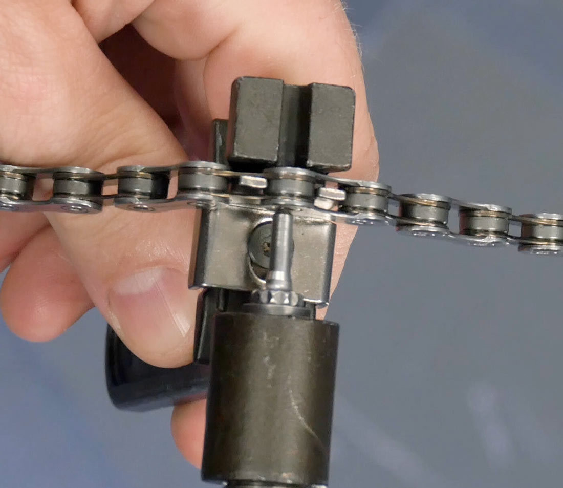 Bring tool into contact with rivet