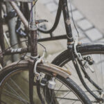 Man holding bicycle wheel